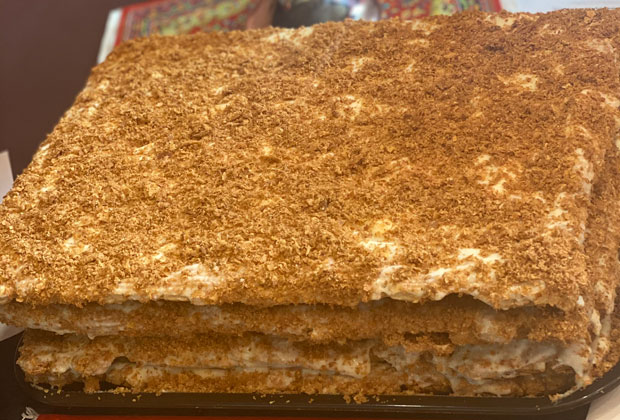 Close-up shot of Napoleon dessert, layered pastry with a sugar crumble on top